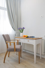 Table with chair in the interior of the room