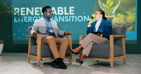 Man, woman and discussion on stage at conference for renewable energy, solution and global policy....