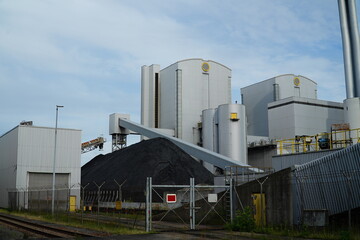 Coal fired power plant with stone coal dump. An old technology that is partly responsible for global warming. Hanover, Germany