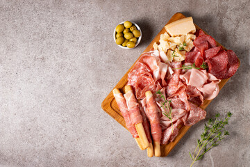 Charcuterie board. Antipasti appetizers of meat platter with salami, prosciutto crudo or jamon and olives.