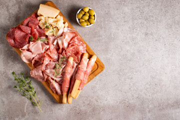 Charcuterie board. Antipasti appetizers of meat platter with salami, prosciutto crudo or jamon and olives.