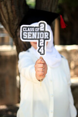 graduate model with hat and symbol