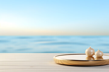 Serene summer beach scene  gold platform with pearl-like objects  blue and gold tones evoke calm.
