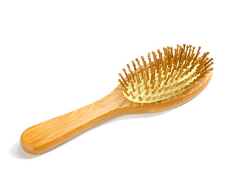 Wooden hairbrush with bamboo pins