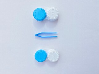 Contact lenses with a container, tweezers, glasses in case. Ccorrecting myopia. Contact lens care, cleaning, health. White Background