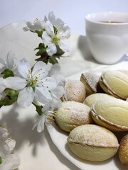 Cookies decorated with powdered sugar on the holiday table