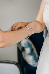 hands placing bracelet