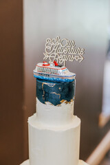 cake with cruise ship topper