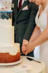 bride and groom cutting cake