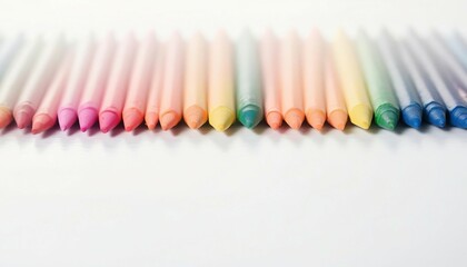 Naklejka premium colored crayons lined up side by side, ad shot