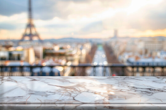 Empty marble table with a blurry view of the lights of Paris background for advertising and for product display, Eiffel tower and parisian roofs at sunrise Paris, France