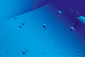 Blue abstract shapes and bubbles, forming a flowing and peaceful pattern, like an underwater scene.