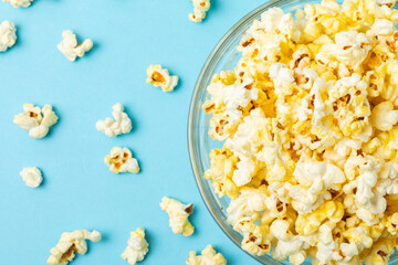 Bowl of salted popcorn on texture background.Cinema and entertainment concept. Movie night with popcorn. Delicious appetizer, snack. Place for text. Copy space. Banner