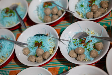 Several bowls of Meatballs on the table
