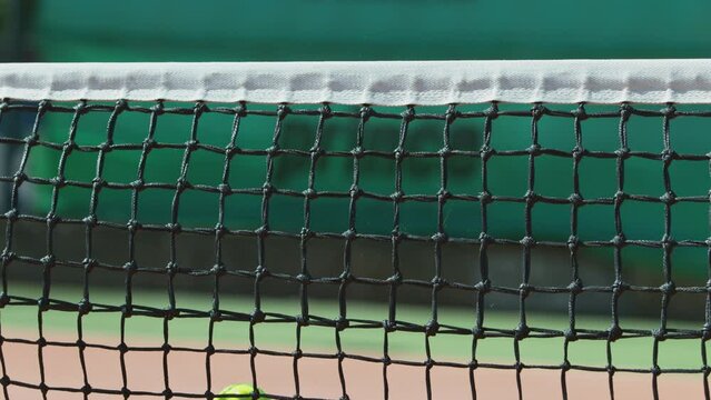 Super slow motion shot of tennis ball hitting the net . Filmed on high speed cinematic camera at 1000 fps.
