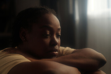 Young upset woman expressing despair while suffering from post traumatic syndrome caused by hard period of her life