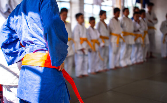 Selective focus in judo class with some students - Powered by Adobe