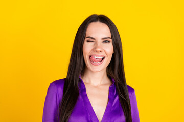 Fototapeta premium Photo of positive lady wink eye lick tongue teeth isolated bright color background