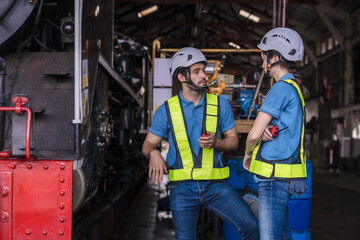 Engineer checking construction process railway and checking work on railroad station . Railway...