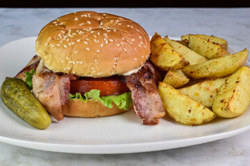 blt sandwich,  with potatoe wedges and pickle