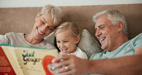 Grandparents, girl and reading book in bed to relax, literature and literacy for bonding at...