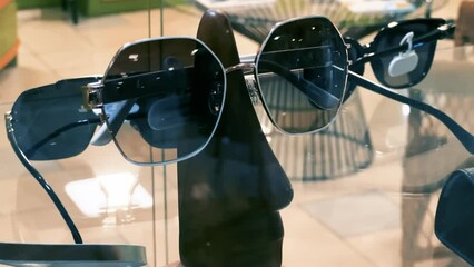 Trendy Sunglasses Collection on Glass Display: Stylish Eyewear Accessories Showcase | Fashion-Forward UV Protection Frames in Luxury Optical Store | Diverse Summer Shades for Modern Lifestyle