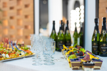 Buffet Table With Wine and Desserts