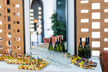 Buffet Table With Appetizers, Wine, and Desserts