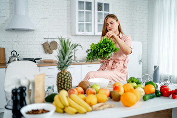 Woman Preparing Salad In Kitchen