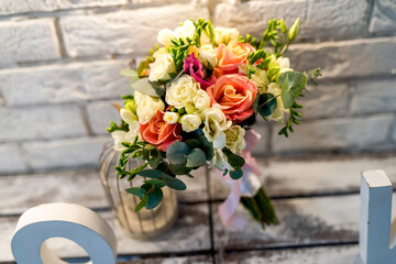 Bridal Bouquet on White Brick Wall