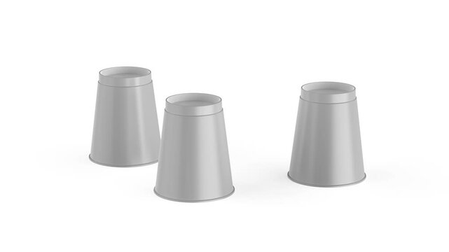 Magic trick with three cups and a gold ball