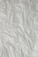 クシャクシャの白い紙　テクスチャ　縦の背景素材　