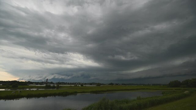 Time-lapse of an ominous looking shelf cloud belonging to a squall line over the river area of The Netherlands.