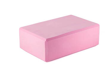 Pink polypropylene yoga block isolated on white background. Sports and health products.