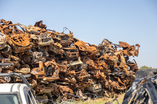 Sa'ad, Israel – May 9 2024, Cars remaining, burned cars after the attack on October 7th by Hamas. The cars were collected on the farmer's field and serves now as an attacks memorial and a remainder.