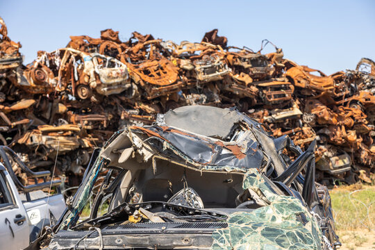 Sa'ad, Israel – May 9 2024, Cars remaining, burned cars after the attack on October 7th by Hamas. The cars were collected on the farmer's field and serves now as an attacks memorial and a remainder.