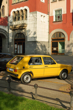 Back side view of Volkswagen Golf 1 J GL (3 door, J - Jugoslavia, TAS plant, Sarajevo) in excellent condition and yellow color. Subotica, Serbia, 21.06.2023 Vertical image