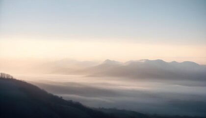 Obraz premium mountain layers and sunrise view in cold and foggy weather.