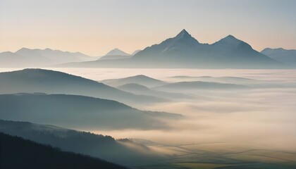 mountain layers and sunrise view in cold and foggy weather.