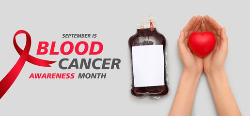 Hands with heart and blood pack for transfusion on grey background. Banner for Blood Cancer...