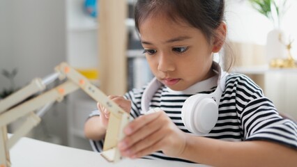 STEM education concept. Asian students learn at home with STEM toys, mathematics engineering science technology computer code in robotics for kids' concepts.