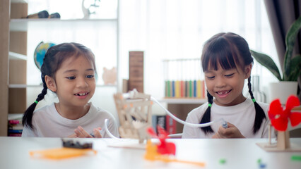 STEM education concept. Asian students learn at home with STEM toys, mathematics engineering science technology computer code in robotics for kids' concepts.