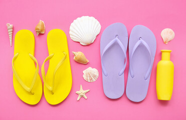 Composition with stylish flip-flops, sunscreen and seashells on pink background