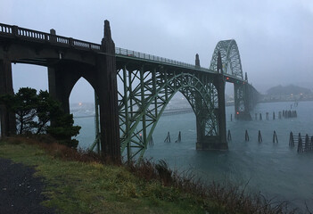 Bridge at Newport OR over Yaquina River at twilight with fog rolling in. 