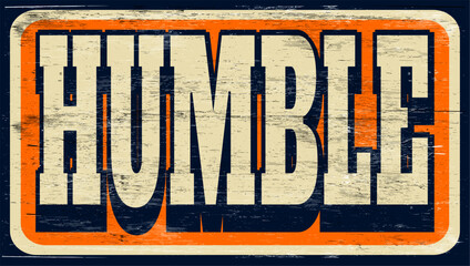 Aged and worn humble sign on wood