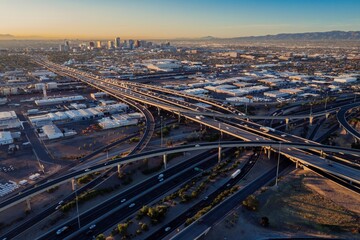 Interstate Freeway junction and rush hour traffic at sunrise. Maryvale, Phoenix, Arizona, United States of America.