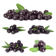 Set of acai berries with green leaves isolated on white