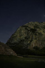 Pyramid and mountain on a lovely starry night.