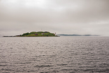 Georges Island Lighthouse in Overcast Weather with Copy-Space