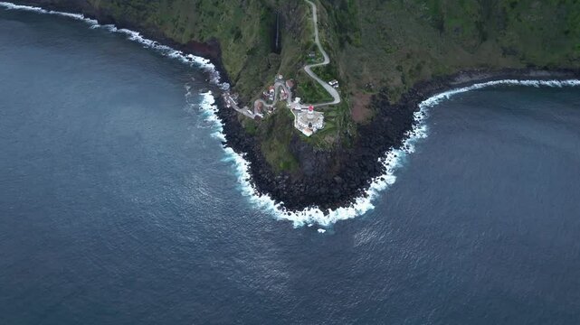 Cliff lighthouse mountain road, ocean coastline, Azores Portugal Drone Landscape